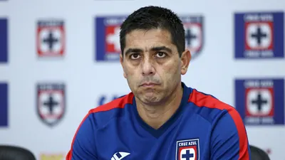 A determined, 35-year-old Cruz Azul sporting director, in a blue and red home kit with the sharp Cruz Azul crest on the...