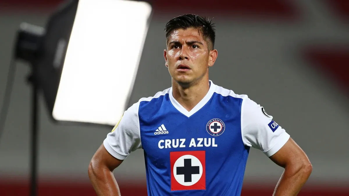 A photorealistic image of an anonymous Cruz Azul player in a blue jersey with white sleeves and a white collar, shot with...