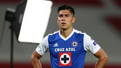 A photorealistic image of an anonymous Cruz Azul player in a blue jersey with white sleeves and a white collar, shot with...