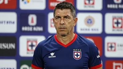 A rugged, 40-year-old Cruz Azul coach, dressed in the club's blue and red home kit with the sharp Cruz Azul crest on his...