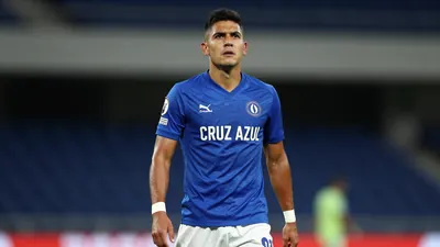 A photorealistic image of a Cruz Azul player, wearing a blue jersey and white shorts, with a determined expression...