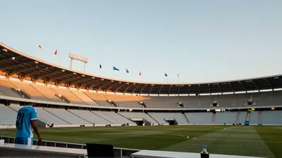A dramatic, hyper-realistic editorial shot of an empty Estadio CD de los Deportes at dusk, the floodlights just igniting...