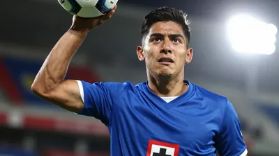 A tight action crop of a young, anonymous, waist-up, head-and-shoulders, 25-30 year-old, male, Cruz Azul player, wearing...